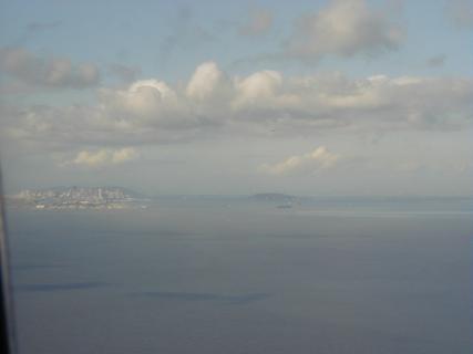 San Francisco and Bay Bridge<br>Location: <a href="https://www.google.com/maps/search/?api=1&query=37.57812,-122.27033" target="_new">Over California</a>